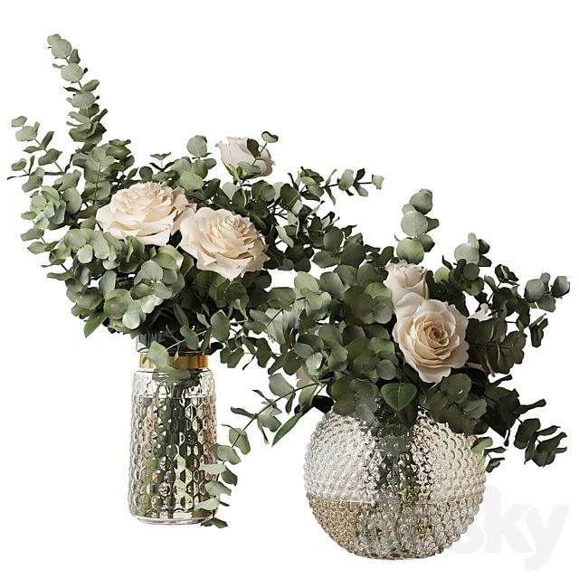 Two bouquets of roses and eucalyptus branches in glass mottled vases